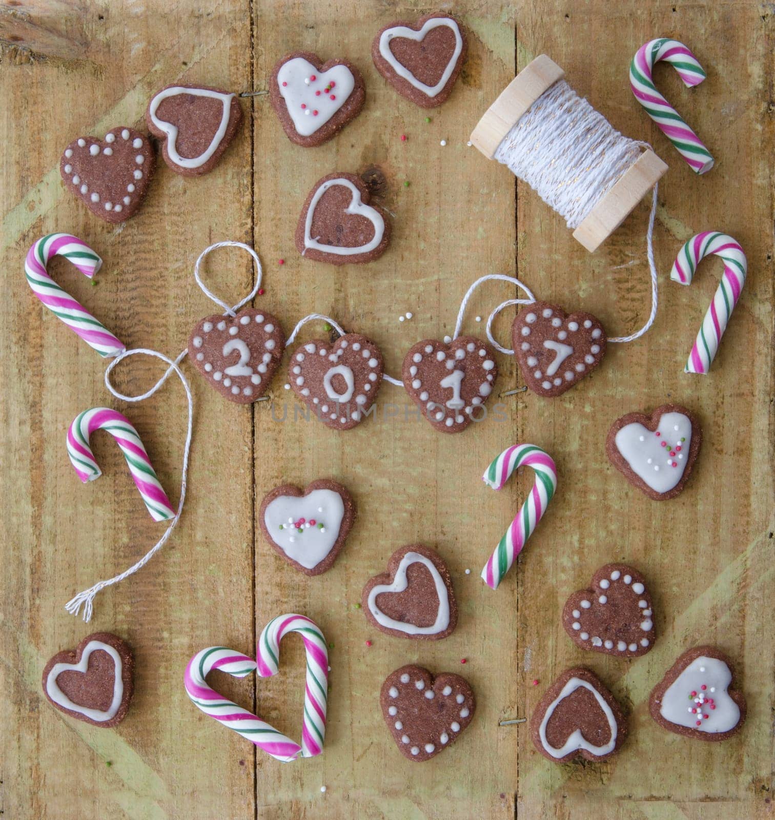 Colorful sweets for Christmas on a rustic wooden background