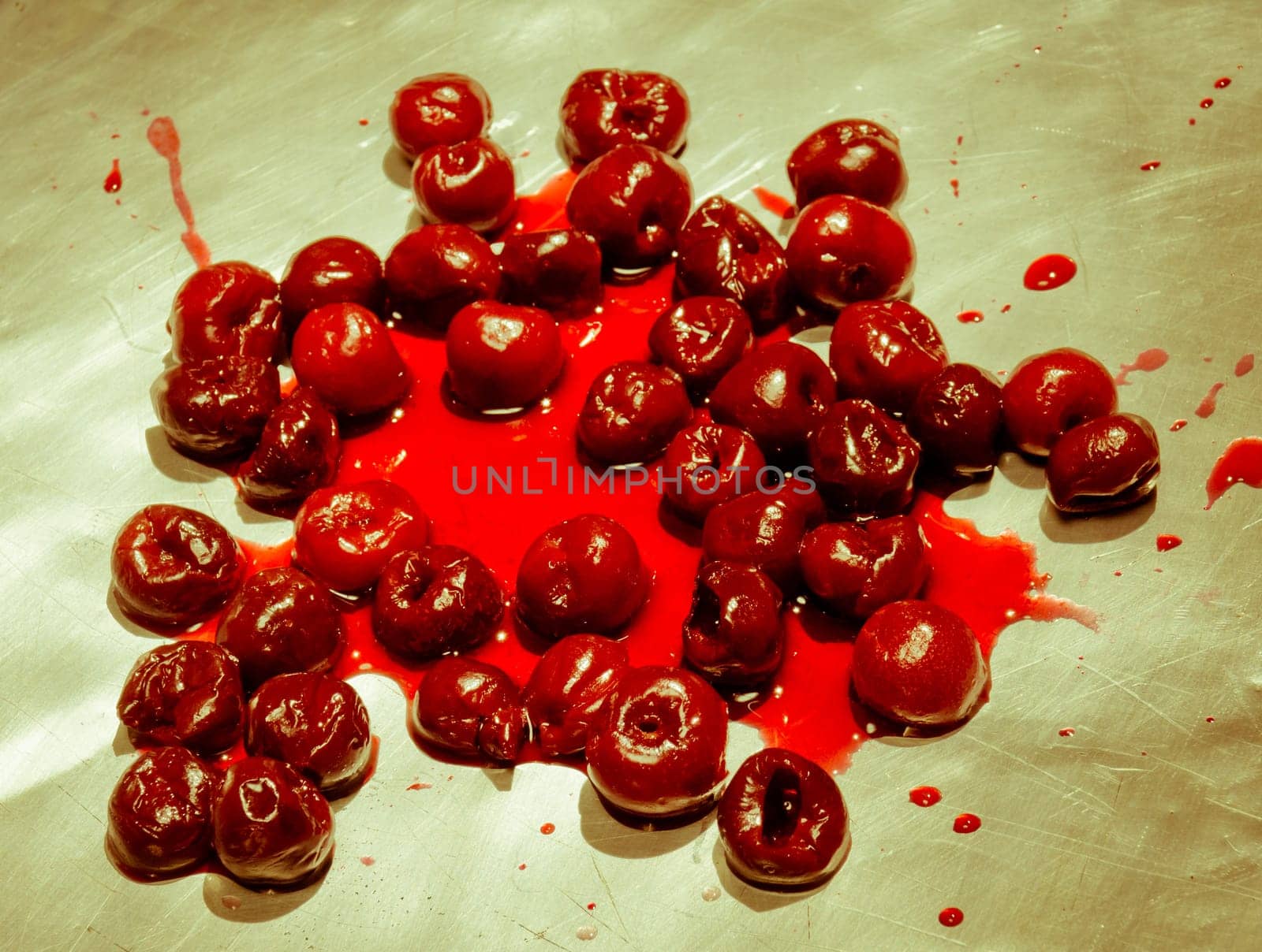 Splashed sour cherries on metallic surface sour cherry fruits pattern