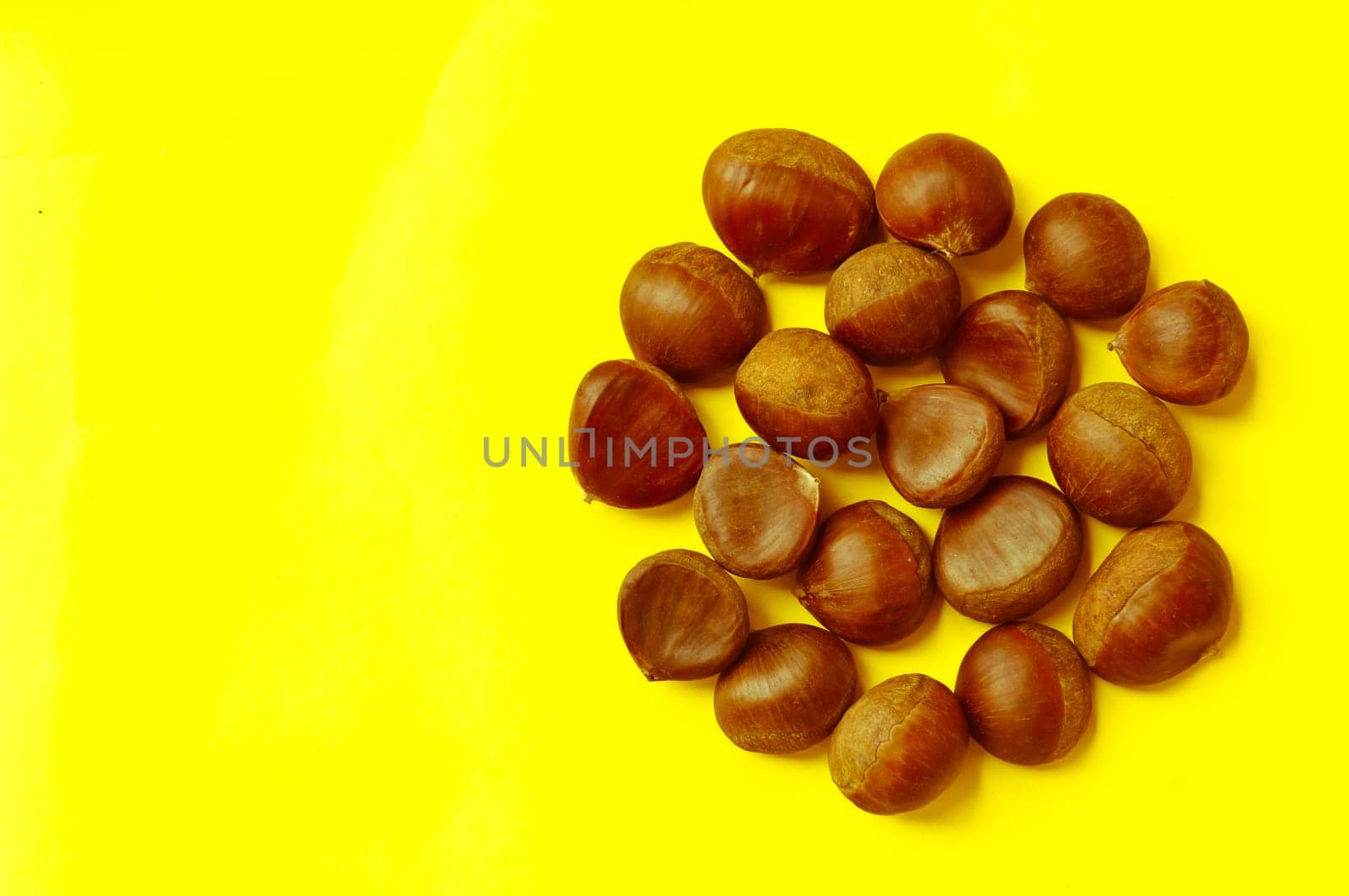 Chestnuts pattern on yellow background, top view, chestnut, castanea