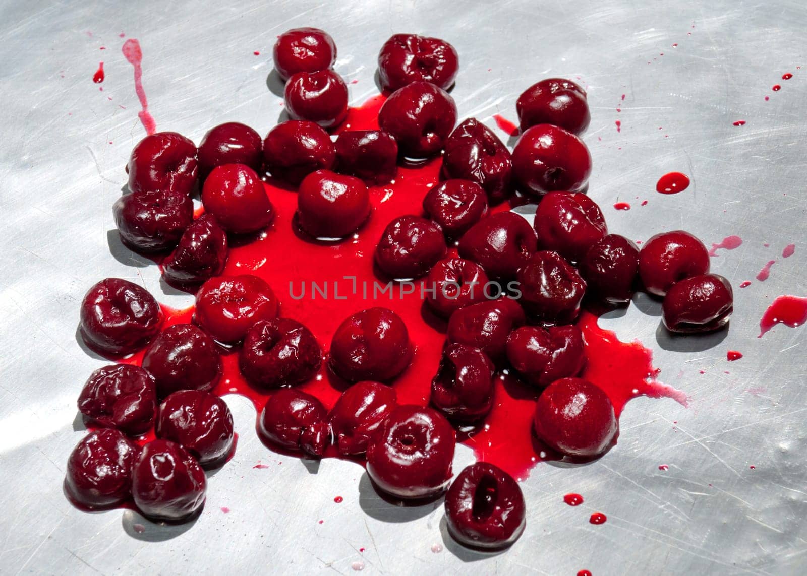 Splashed sour cherries on metallic surface sour cherry fruits pattern