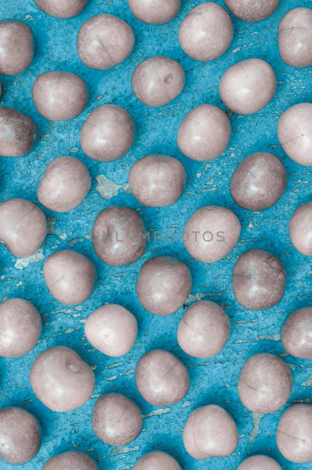 Arrangement of ripe cherries on blue textrured background, cherry pattern