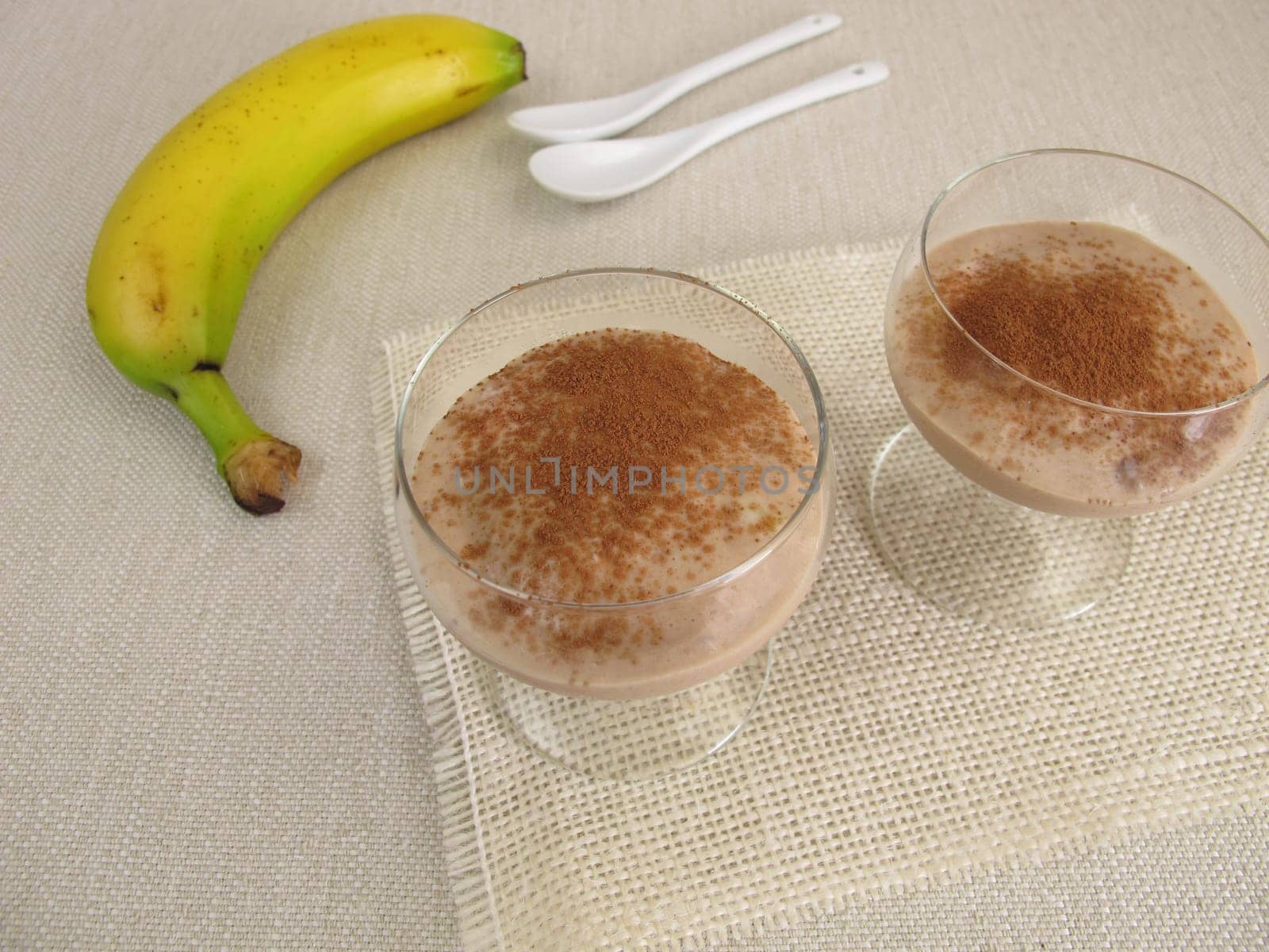 Homemade chocolate ice cream dessert with frozen bananas and cocoa