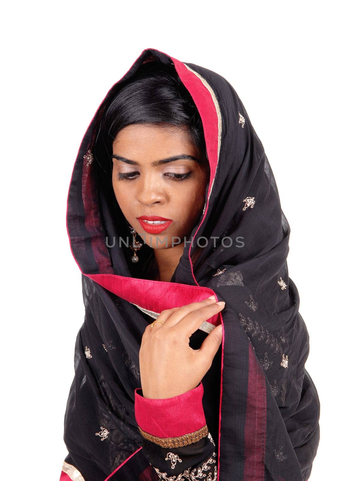 A lovely young Indian woman covered in a black veil, looking down,.isolated for white background..