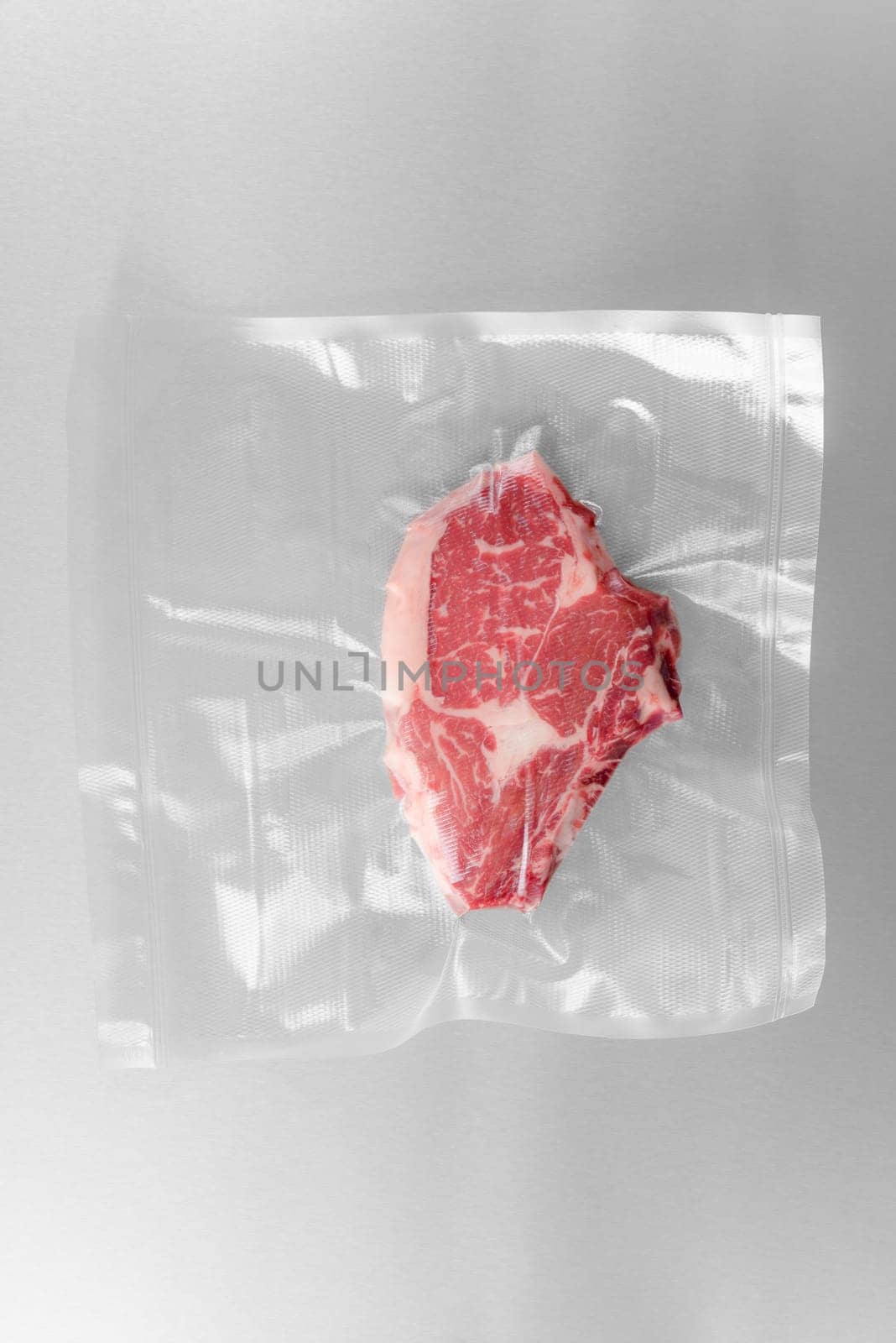 Vacuum sealed fresh rib eye steak for sous vide cooking