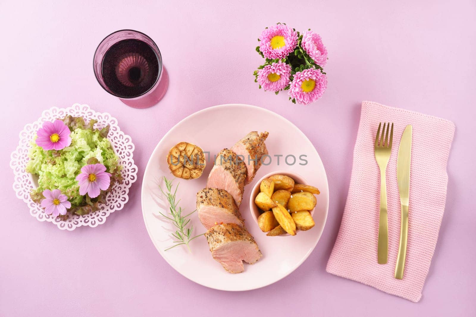 Fillet with salad womanly styled on pink table