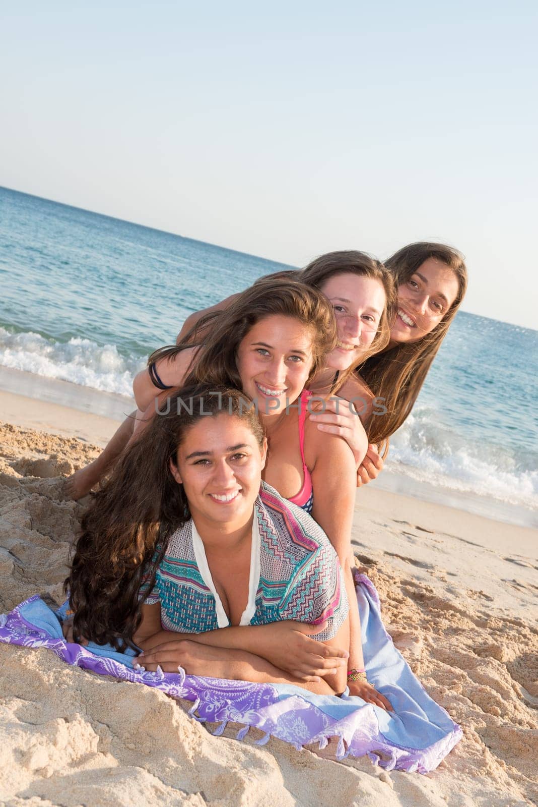 Group of happy teenage girls at the beach