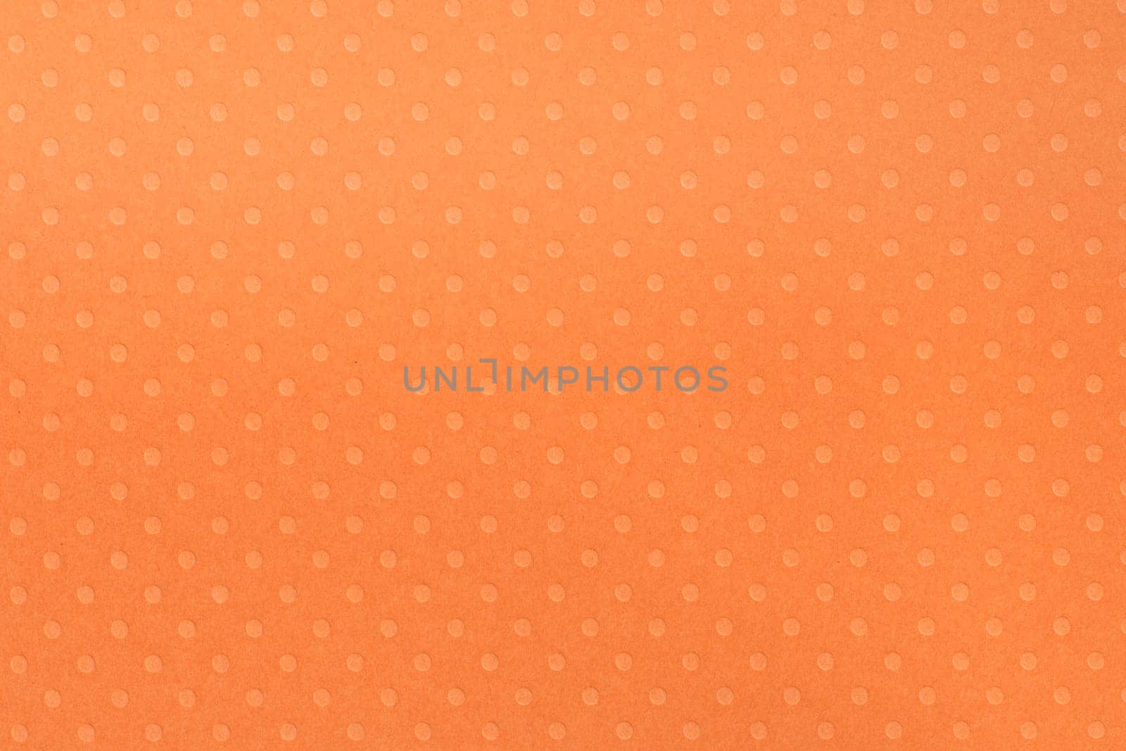 Colorful polka dot paper background texture.