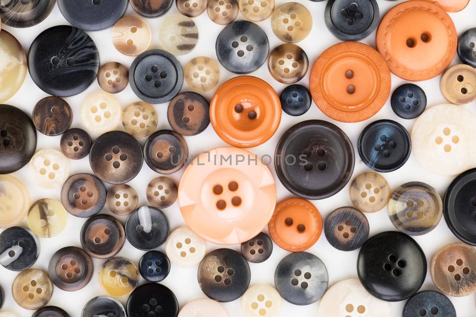 Button texture with orange and black tones.