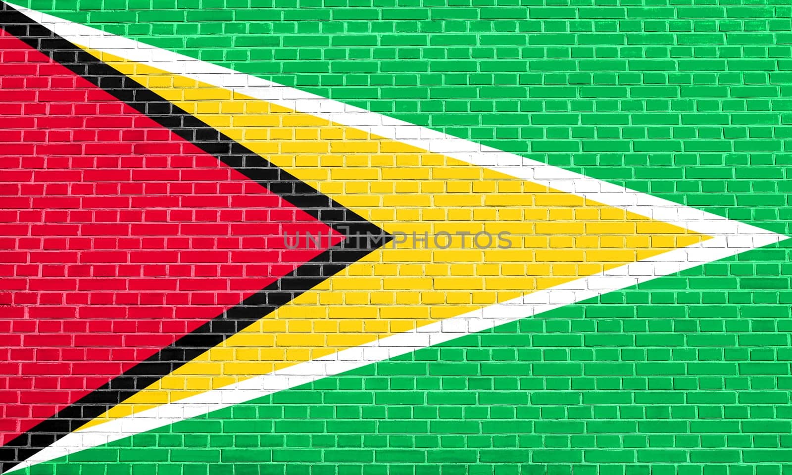 Guyanan national official flag. Patriotic symbol, banner, element, background. Flag of Guyana on brick wall texture background