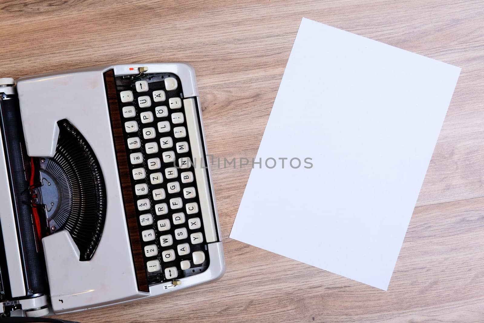 old typewriter on wooden ground from above