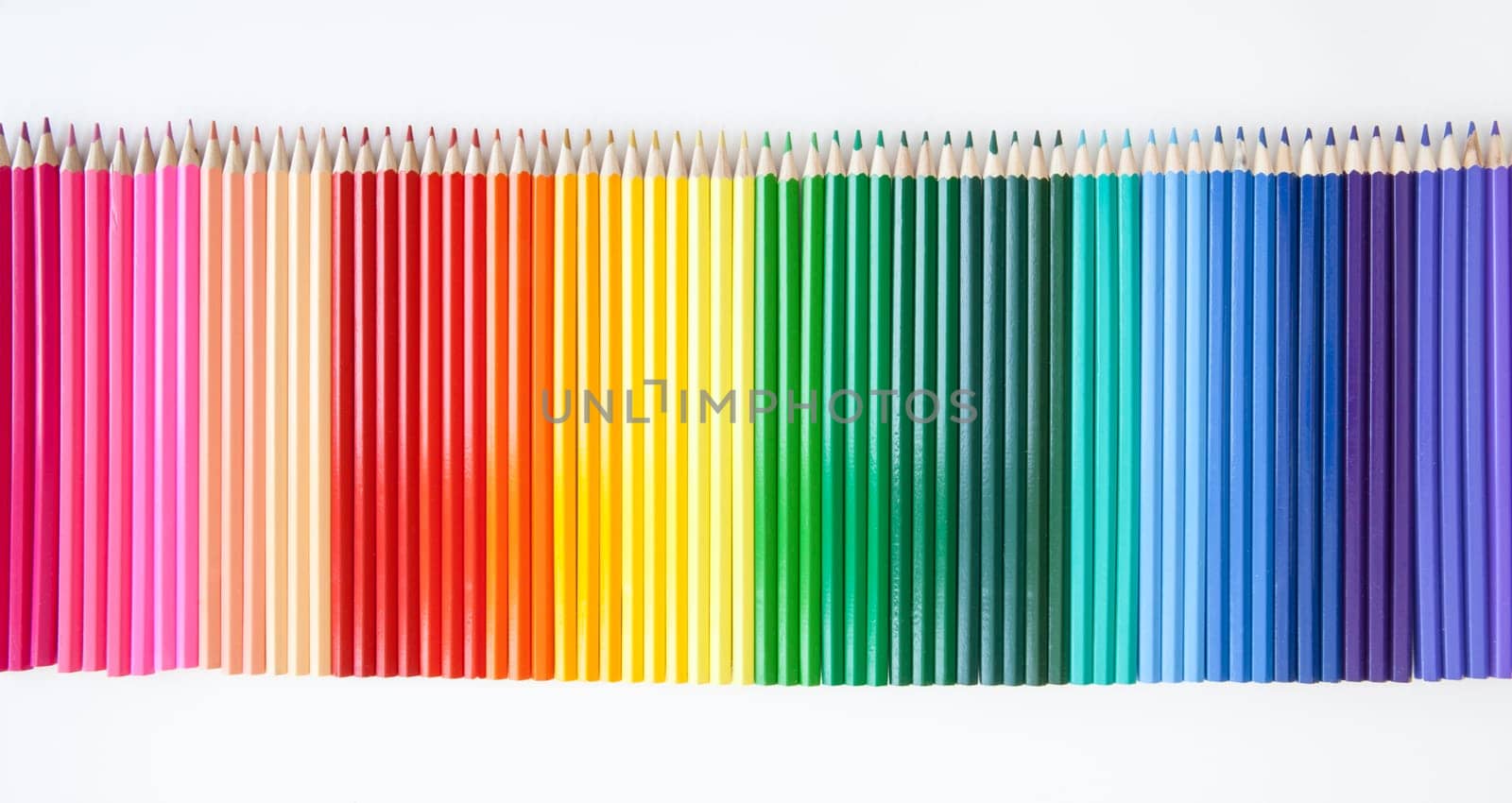 Many colorful pens arranged in series with text space