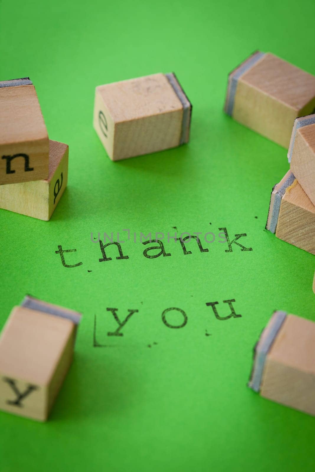 Thank you with stamps on green background