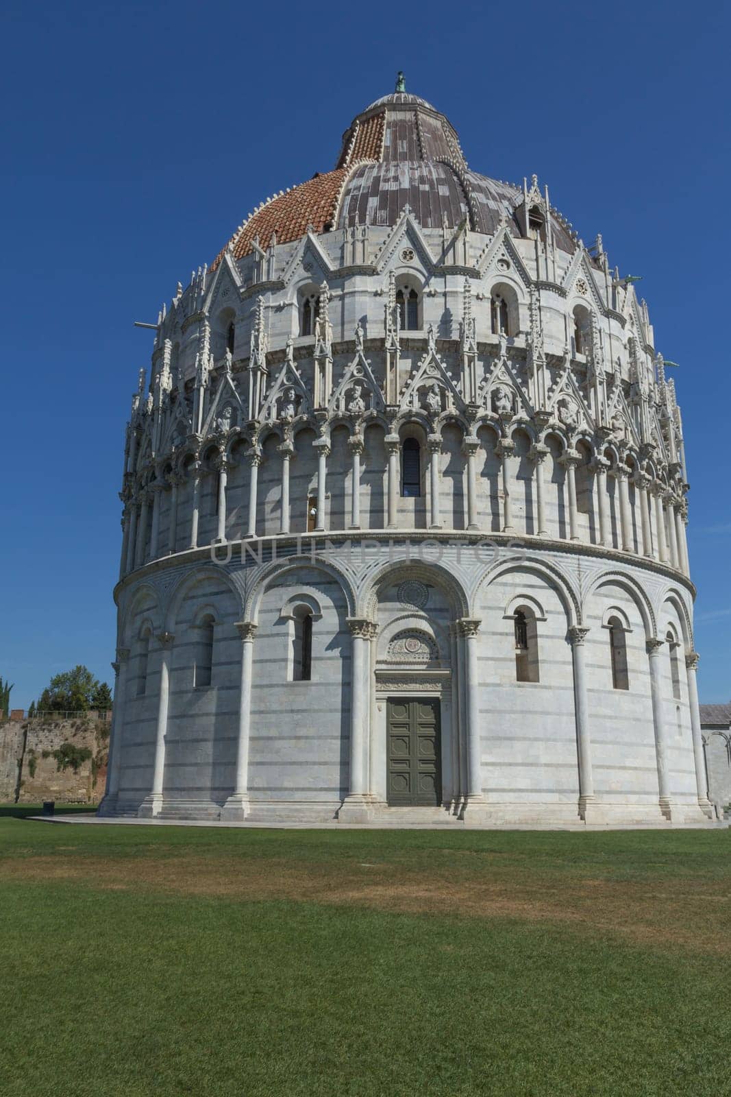 General view of the Baptistery at the Piazza del Duomo in Pisa (Tuscany, Italy)