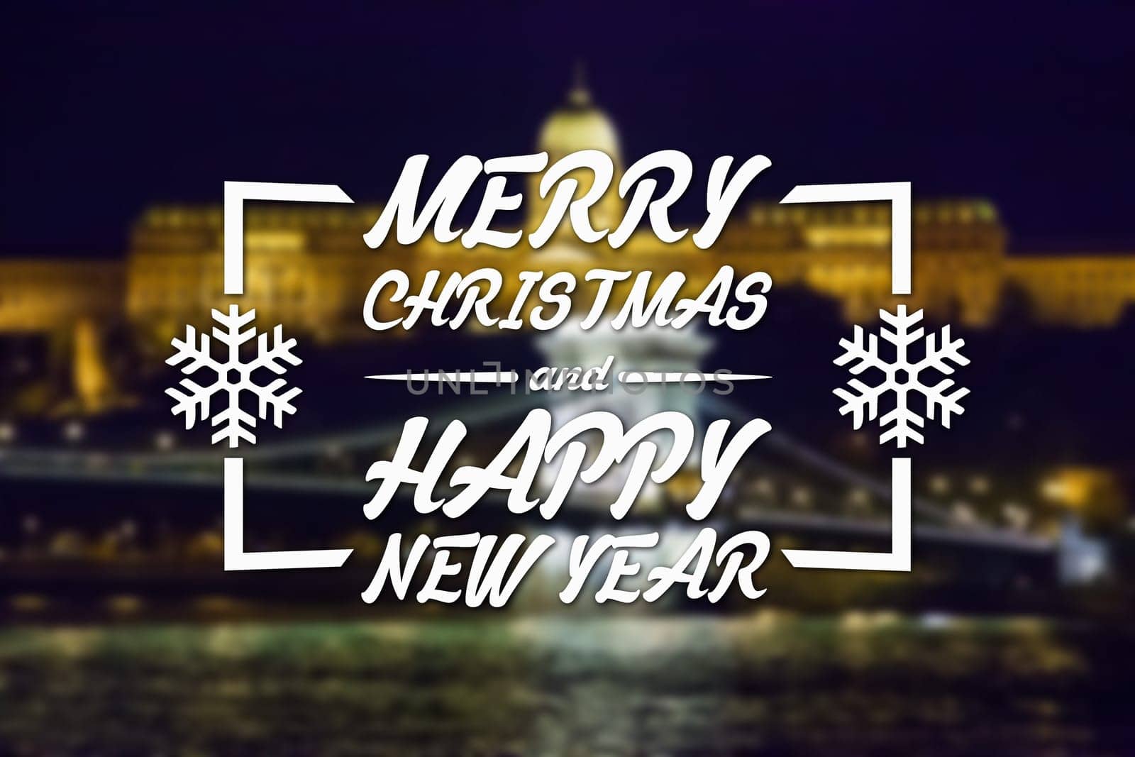 Merry Christmas and New Year greeting card on blurred night city illuminated old buildings with reflection in water background
