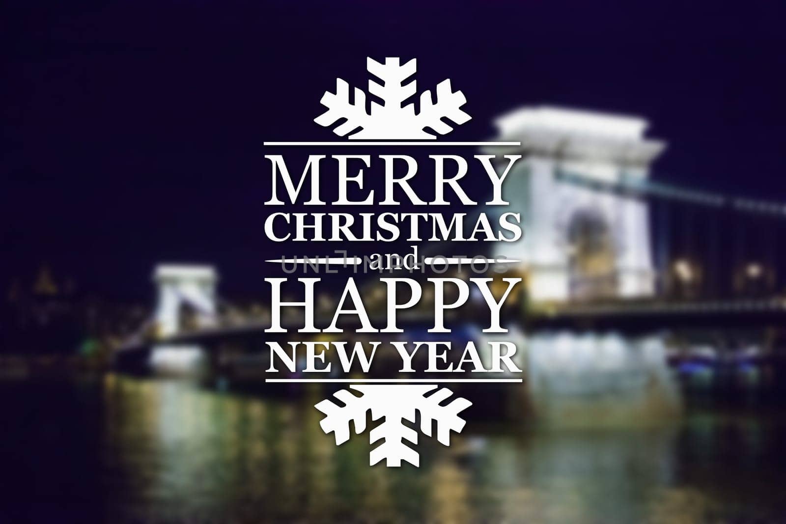 Merry Christmas and New Year greeting card on blurred night illuminated old bridge with reflection in water background