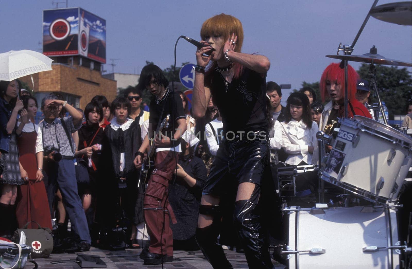 a Japanese Youth Punk Band plays on a square in the City of Tokyo in Japan in Asia,....