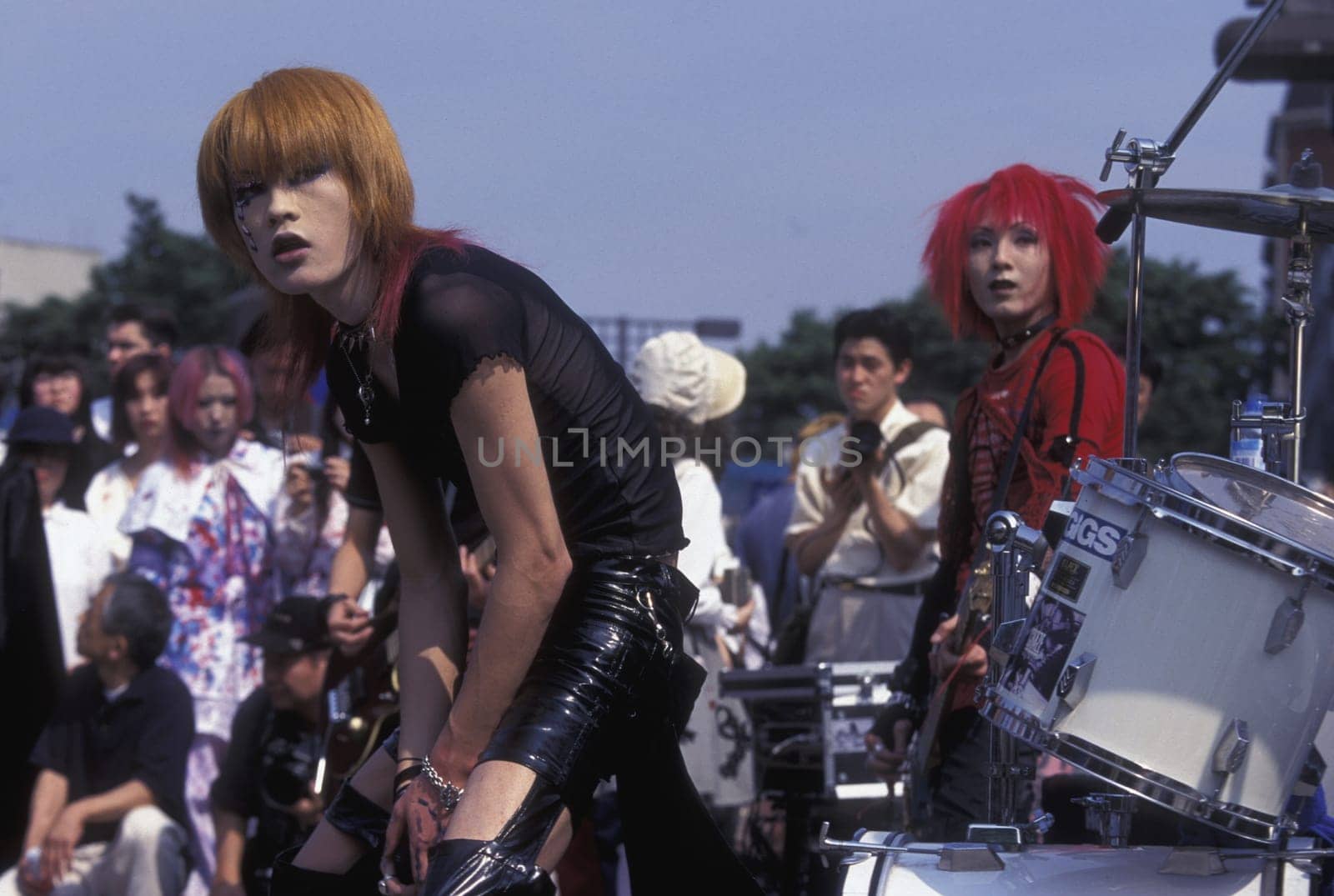 a Japanese Youth Punk Band plays on a square in the City of Tokyo in Japan in Asia,....