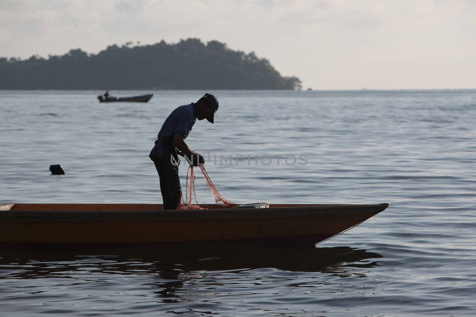 a fishermen on the coast near the city of Bandar seri Begawan in the country of Brunei Darussalam on Borneo in Southeastasia.