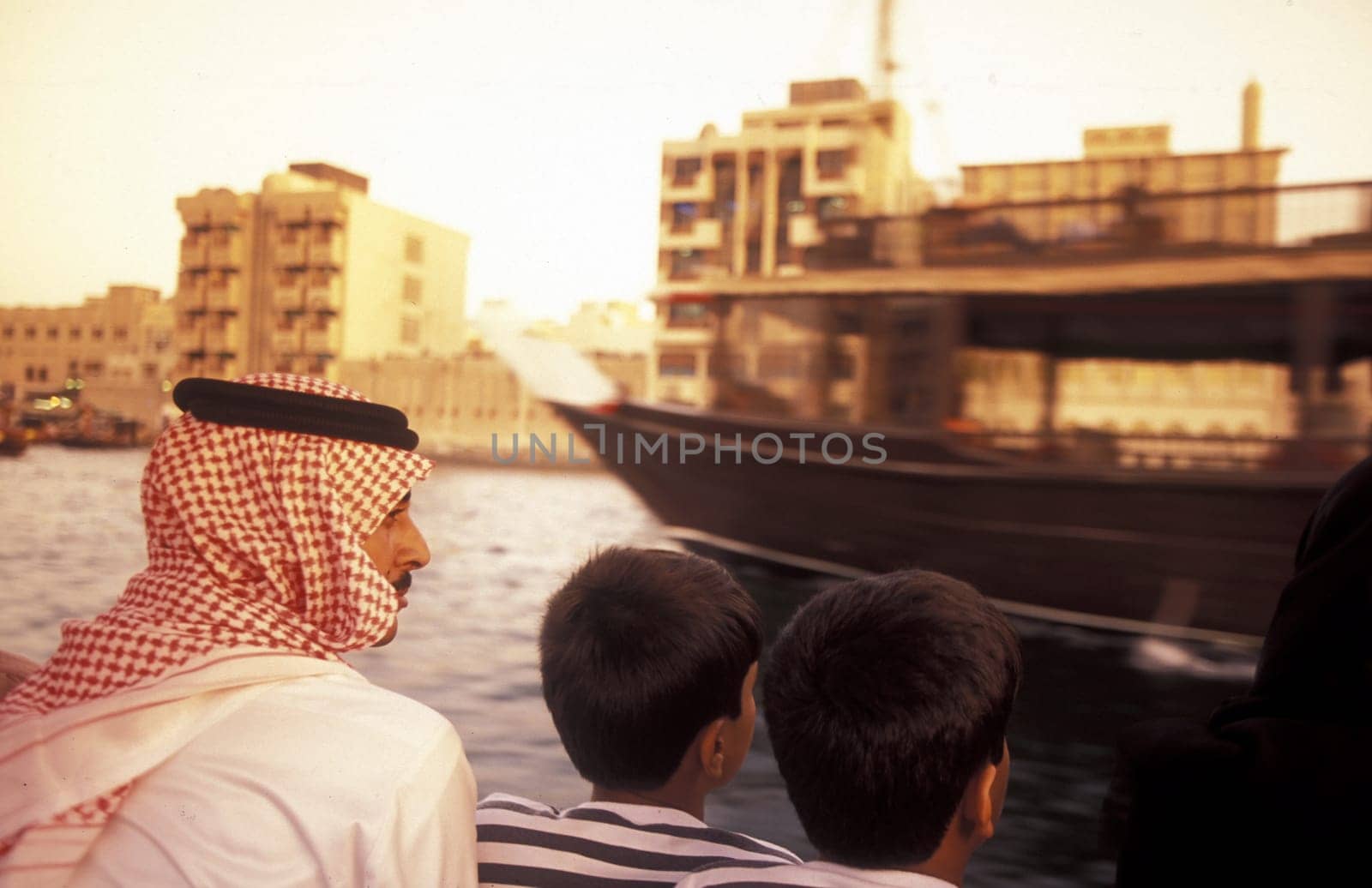 a city boat and ferry on the Dubai creek in the old town in the city of Dubai in the Arab Emirates in the Gulf of Arabia.