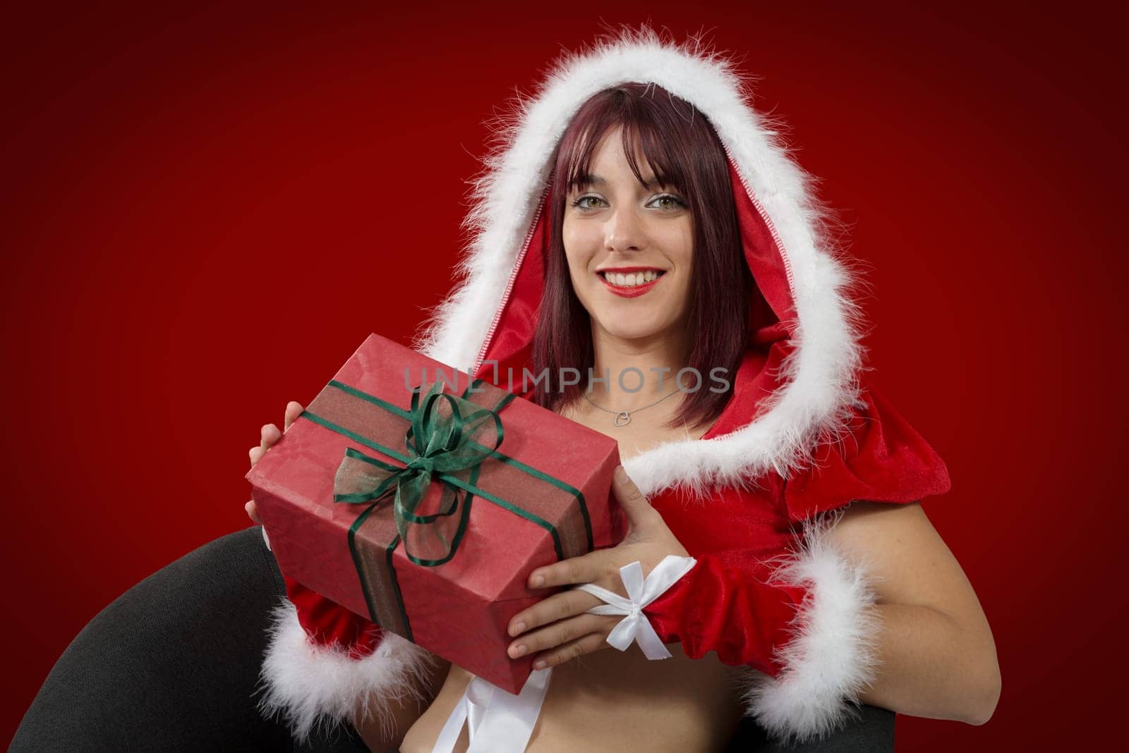 a portrait of beautiful sexy girl wearing santa claus clothes