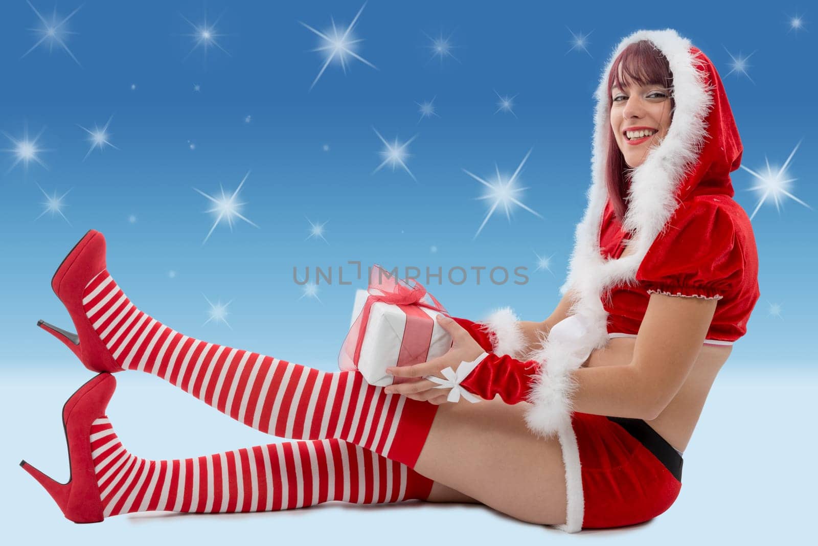 a beautiful sexy girl wearing santa claus clothes