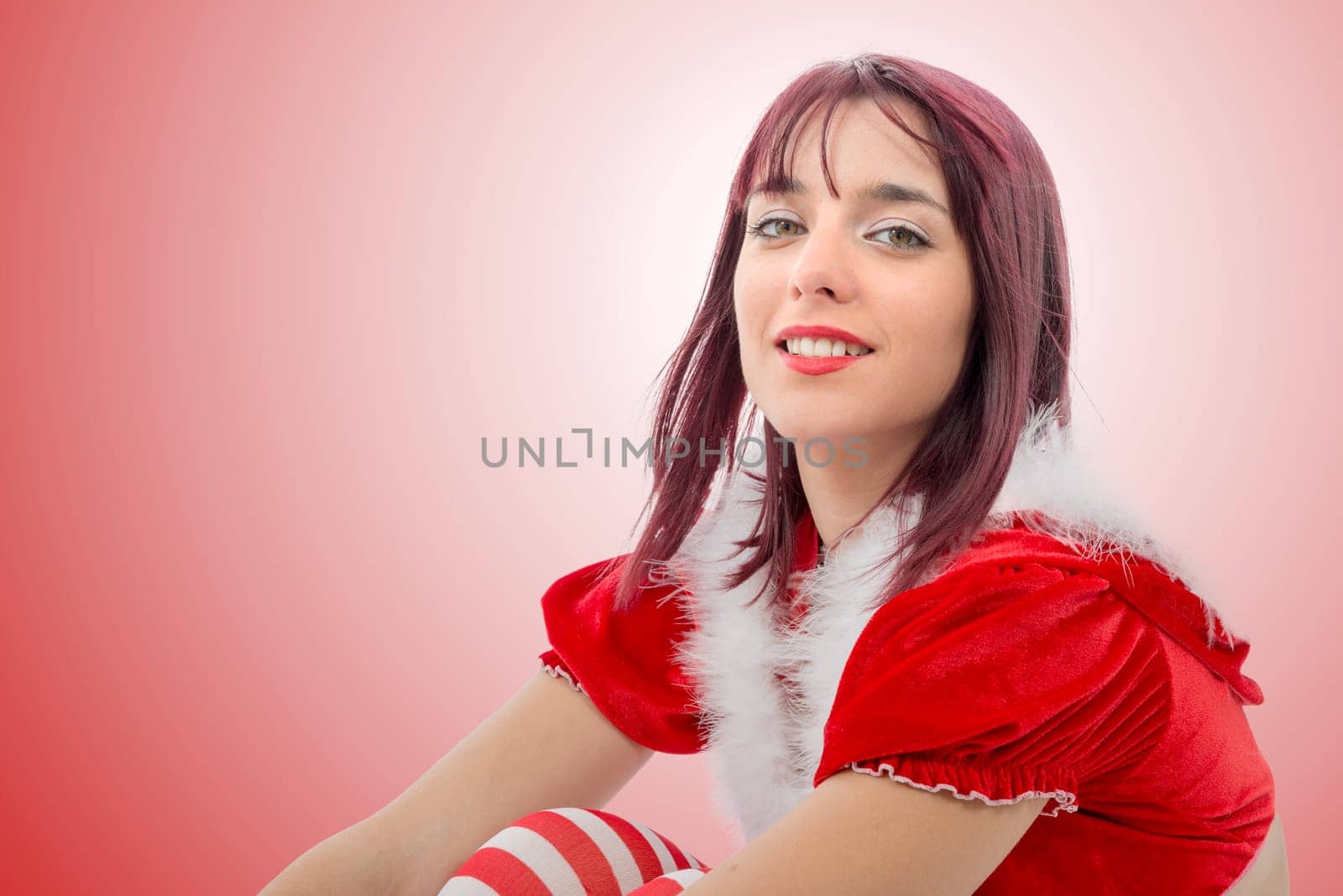 a portrait of beautiful sexy girl wearing santa claus clothes