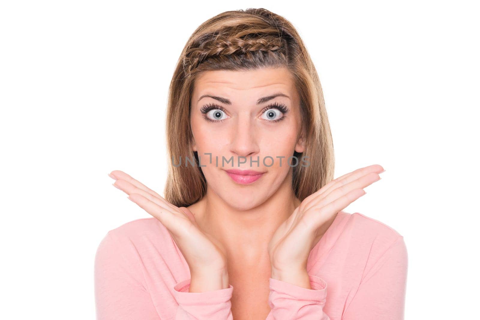 Astonished young woman against a white background