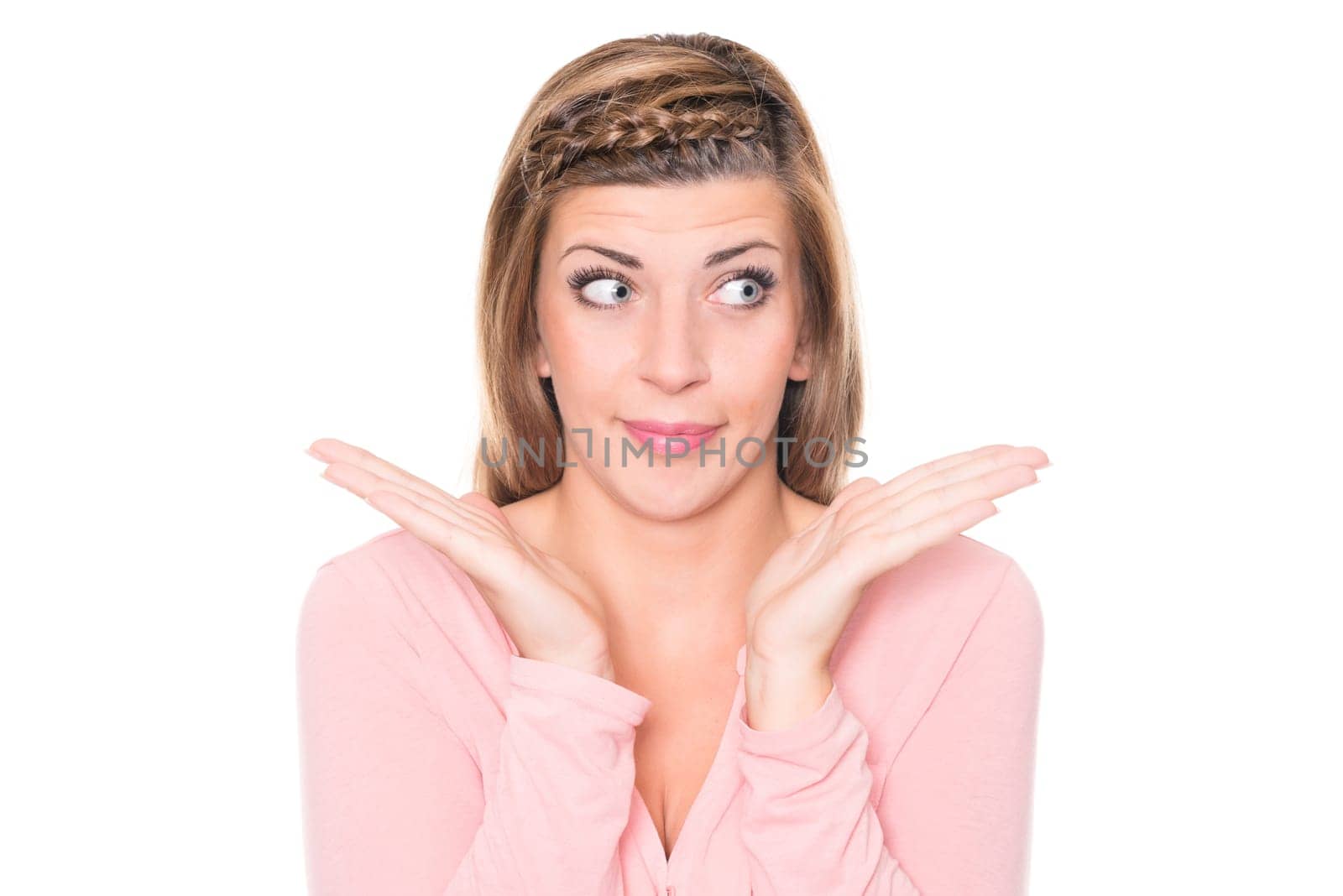 Astonished young woman against a white background