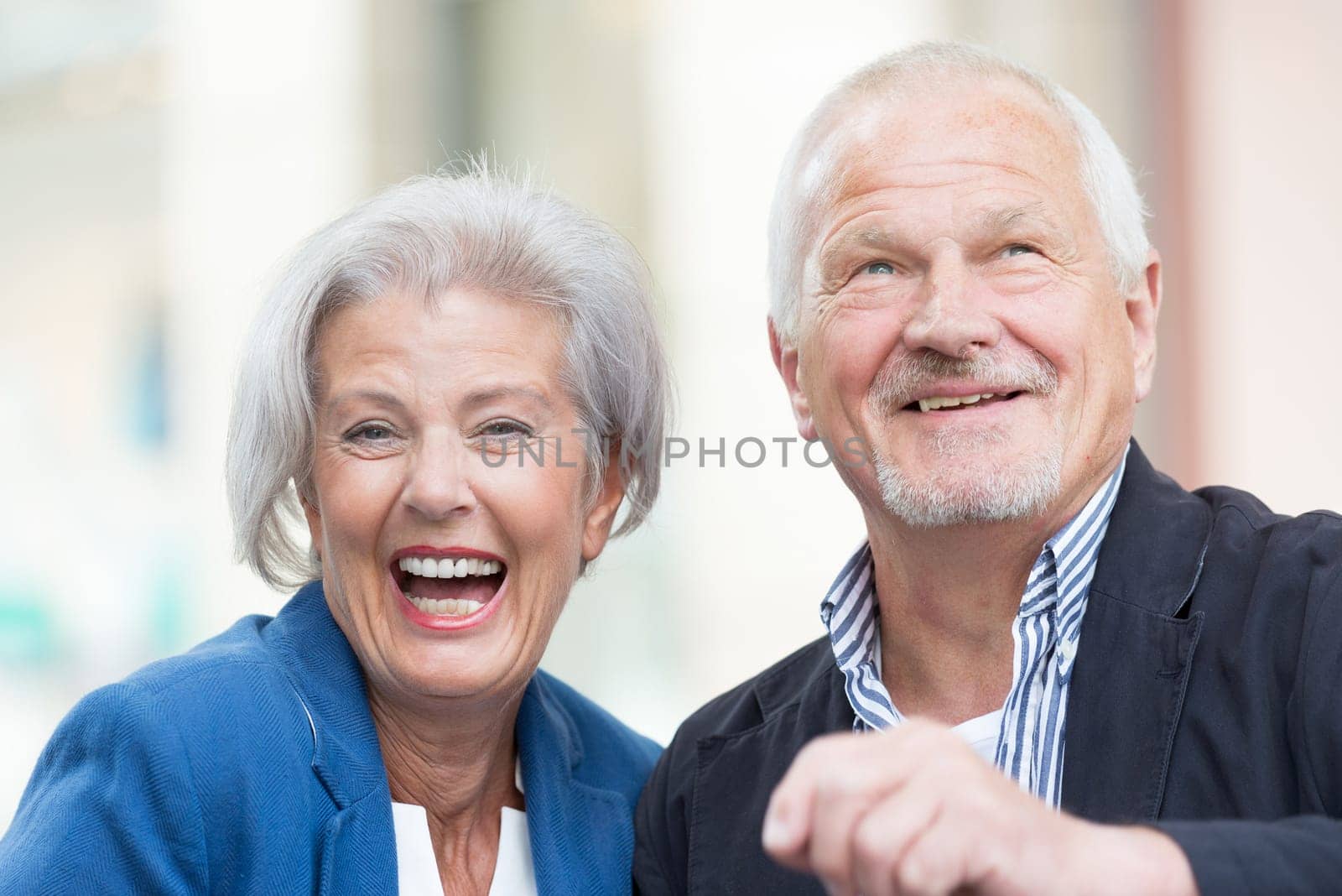 Active senior couple against an urban background