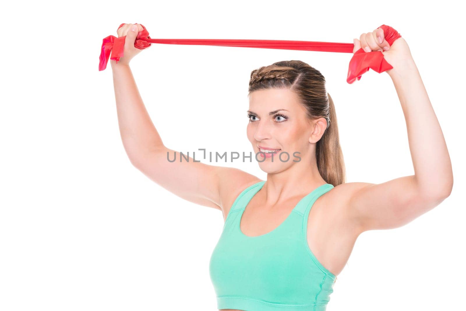 Studio recording of a young woman with a red gymnastics band against a white background