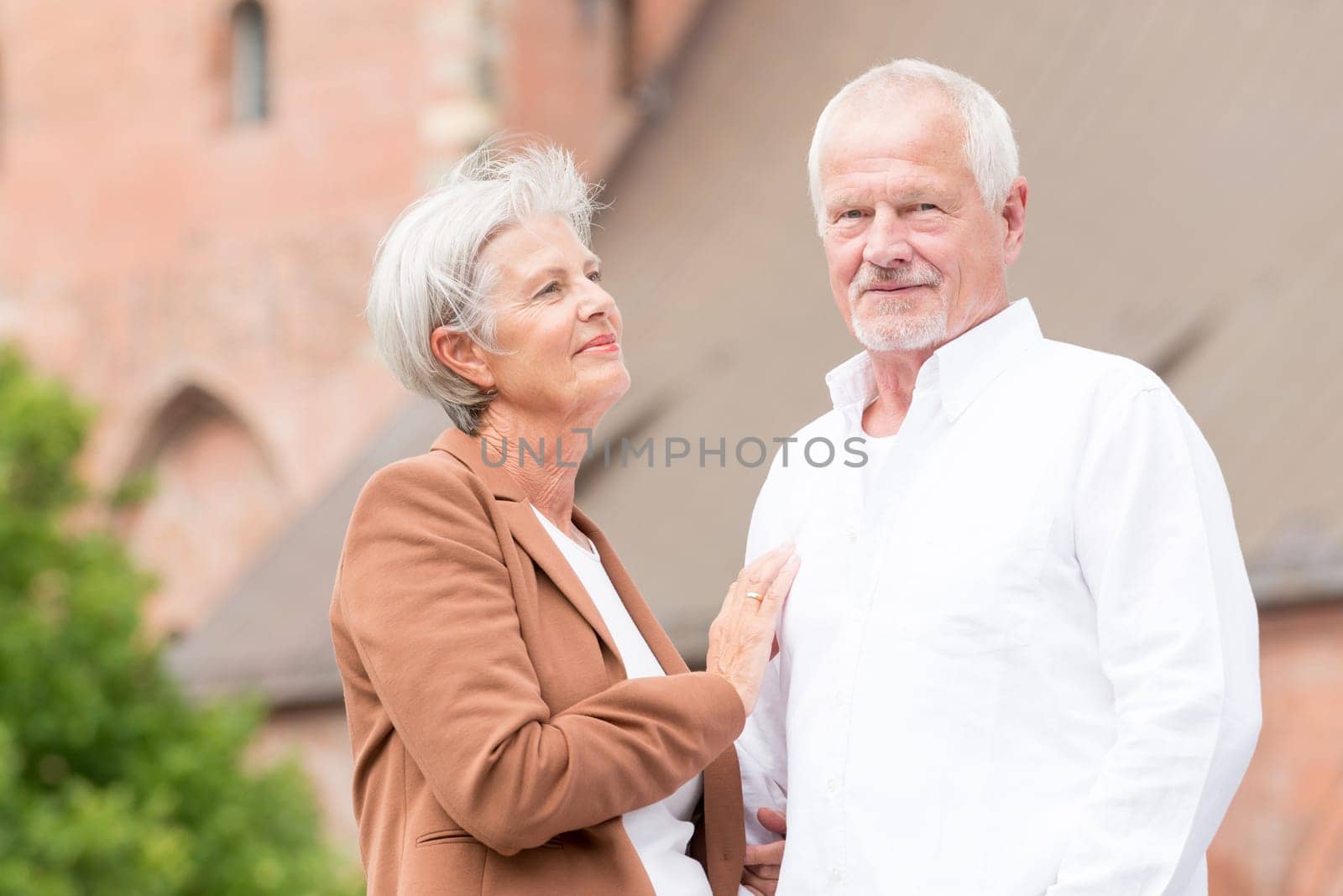 Active senior couple against an urban background