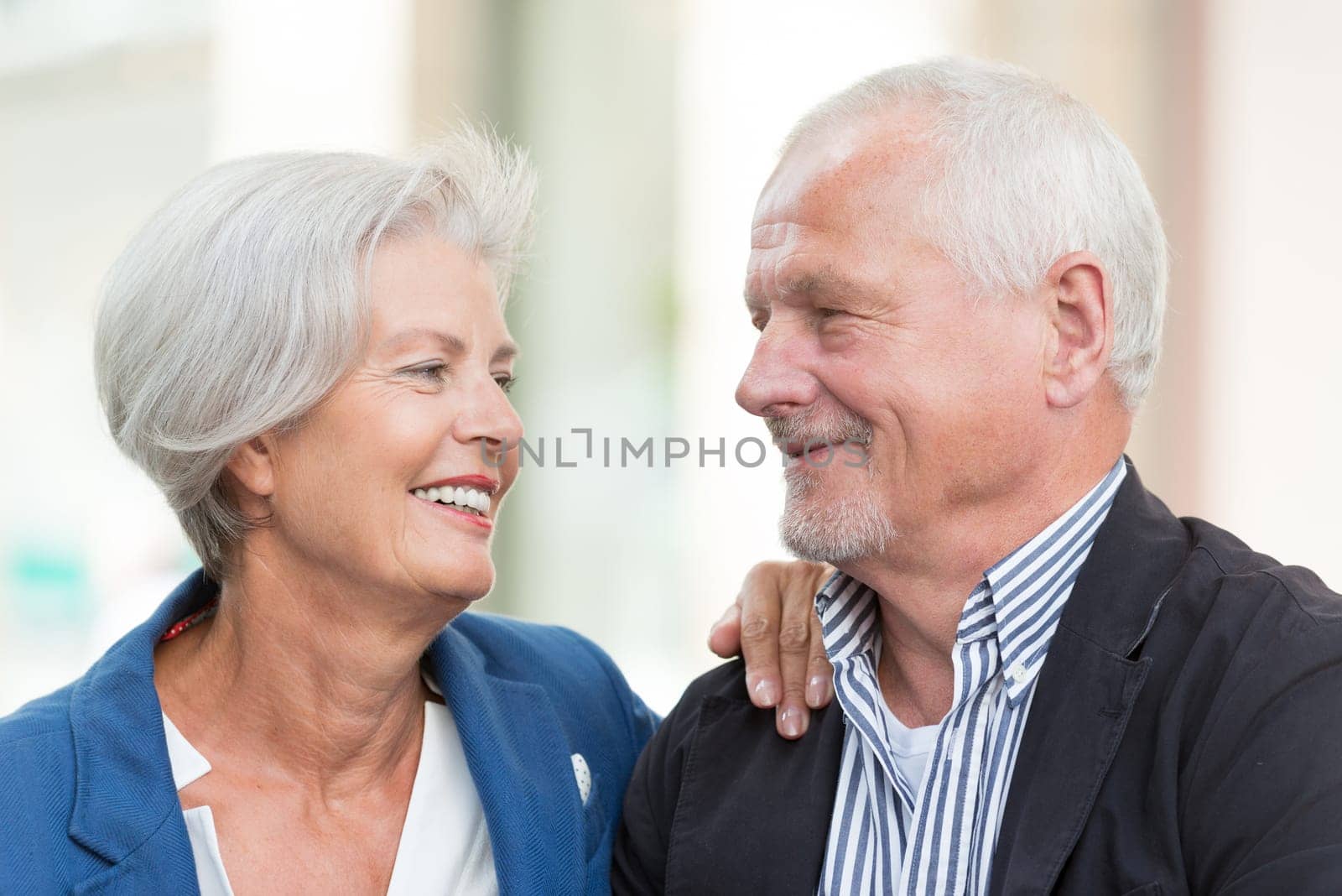 Active senior couple against an urban background