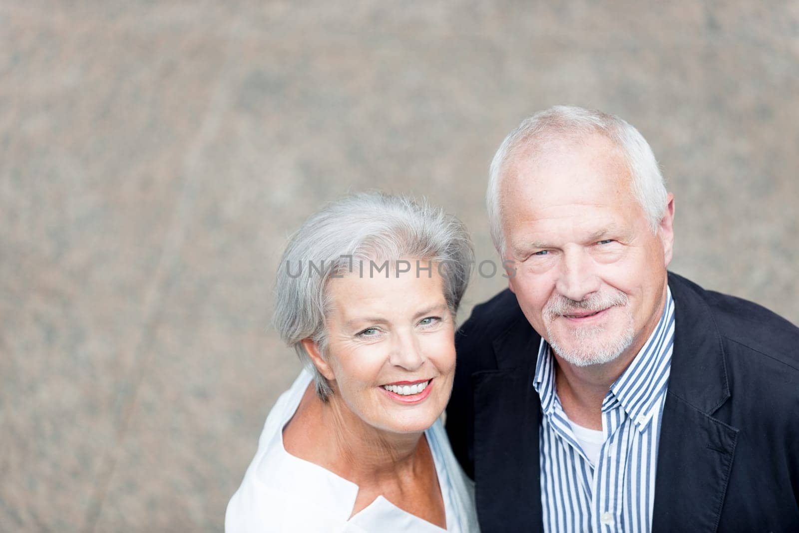 Active senior couple against an urban background