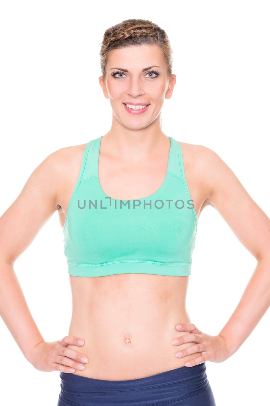 Studio recording of a young woman playing sports against a white background