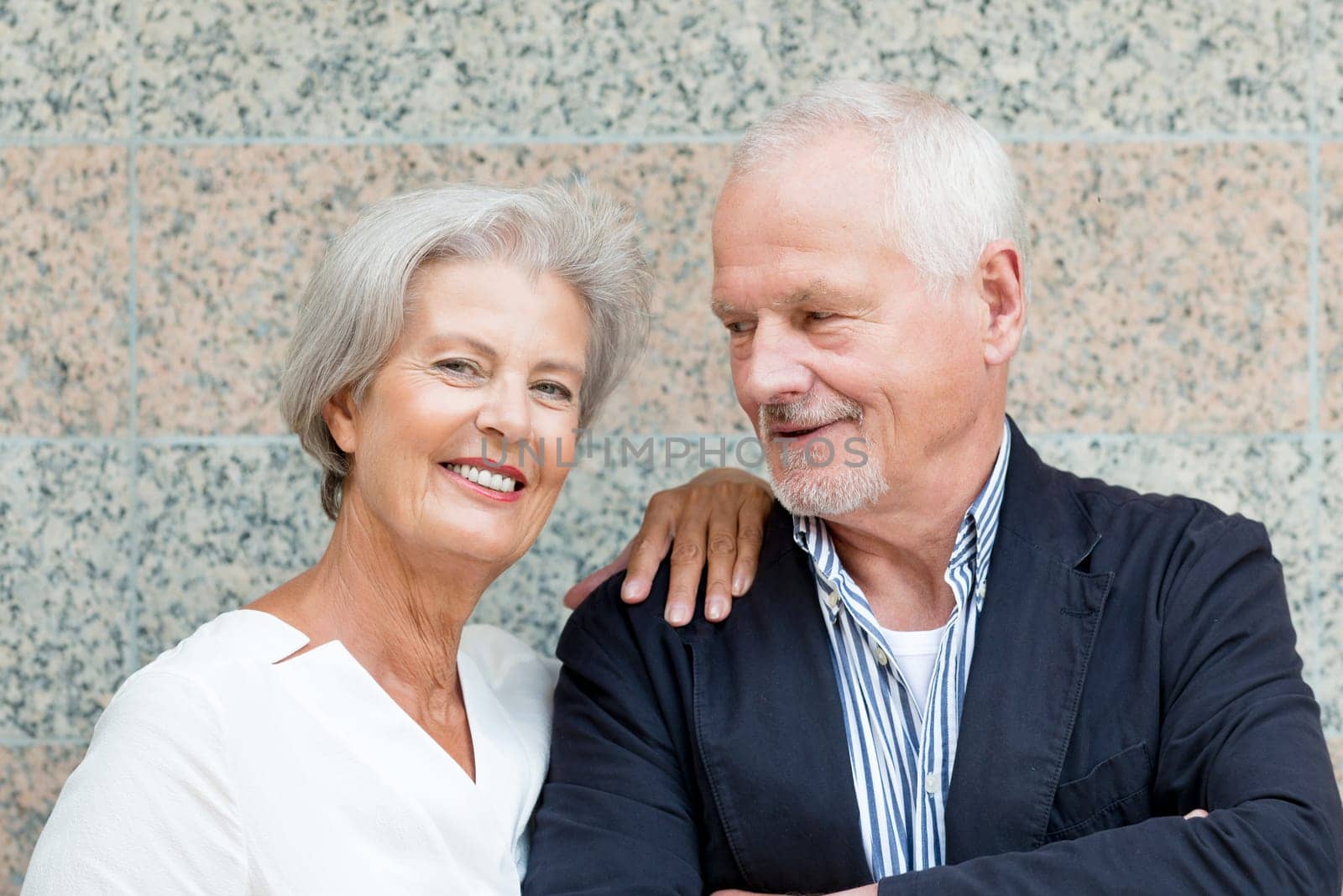 Active senior couple against an urban background