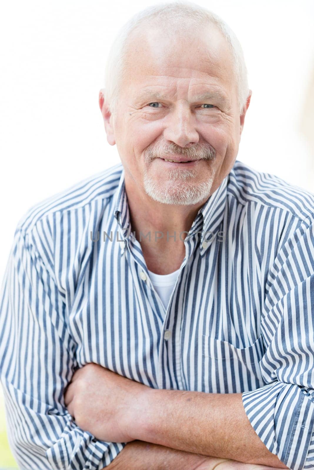 Smiling senior against a white background