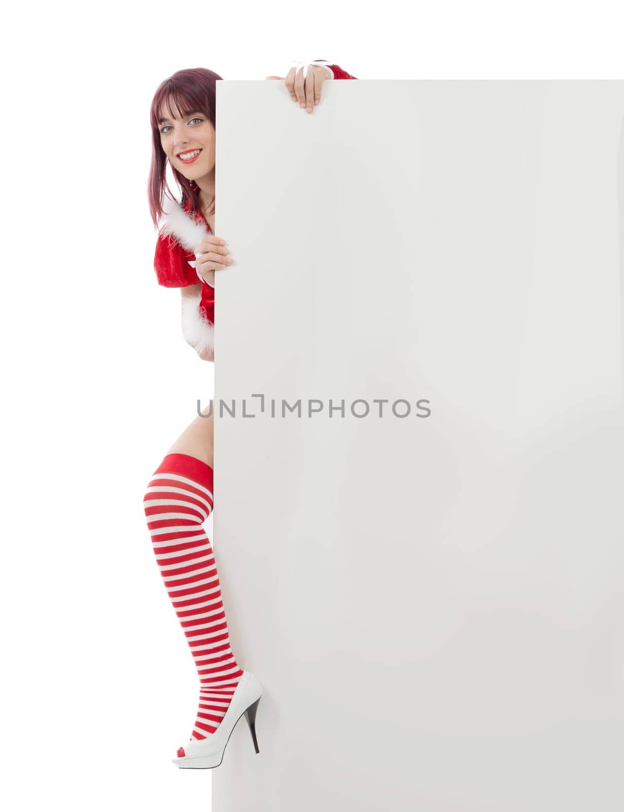 Smiling girl in santa clause costume on white