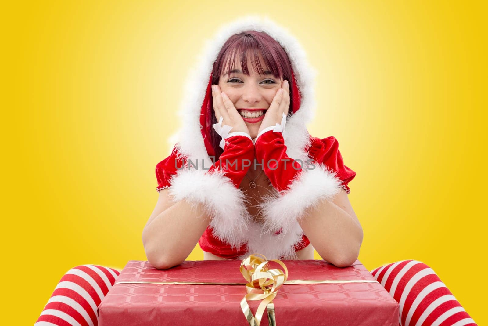 a portrait of beautiful  girl wearing santa claus clothes