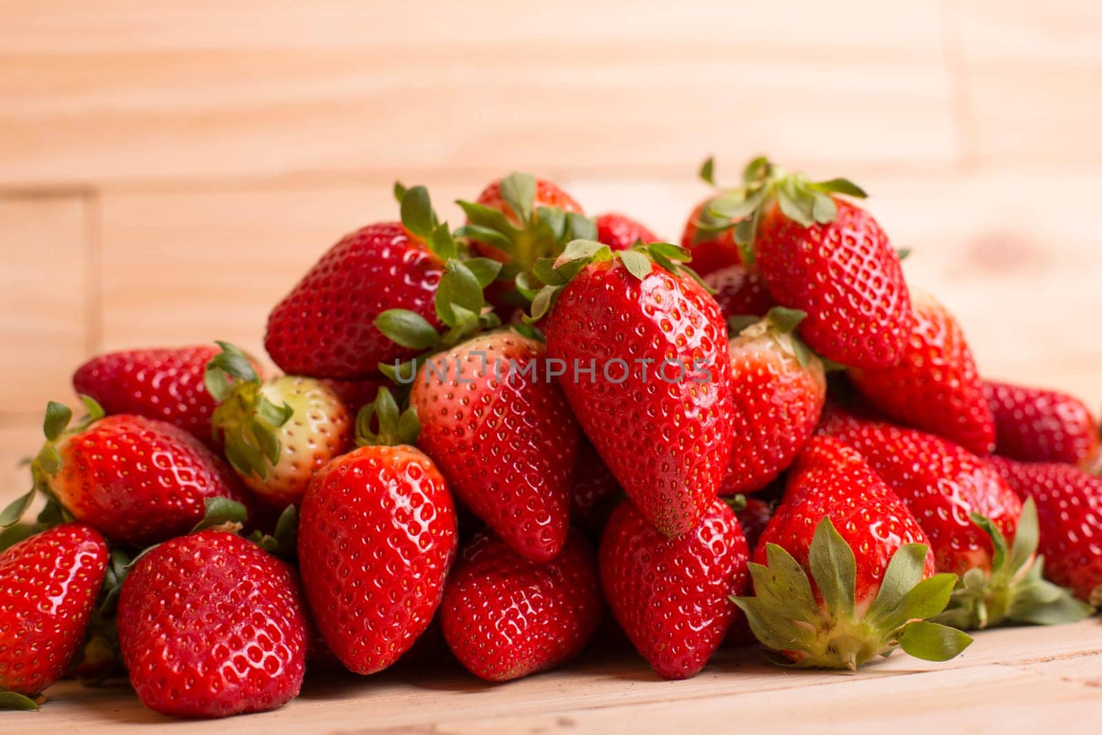 strawberries on a wooden table, studio picture