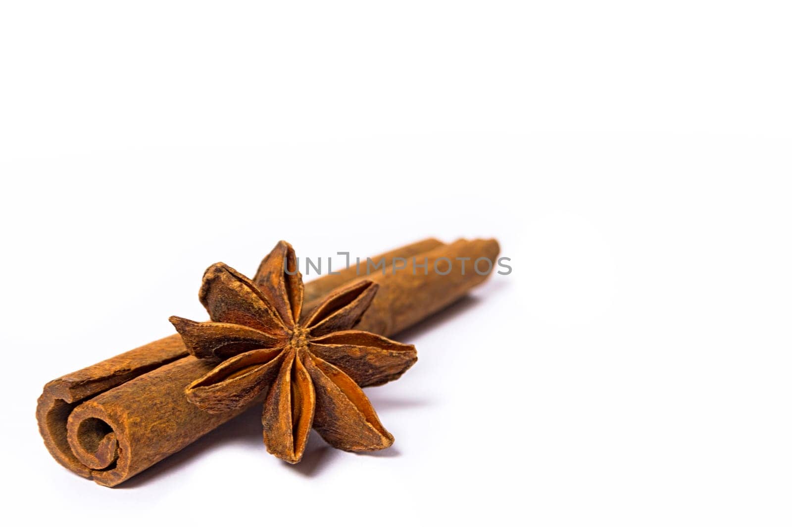 cinnamon and star anise spice isolated on white background closeup