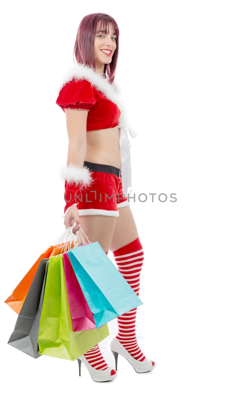 a beautiful Santa Claus woman holding shopping bags