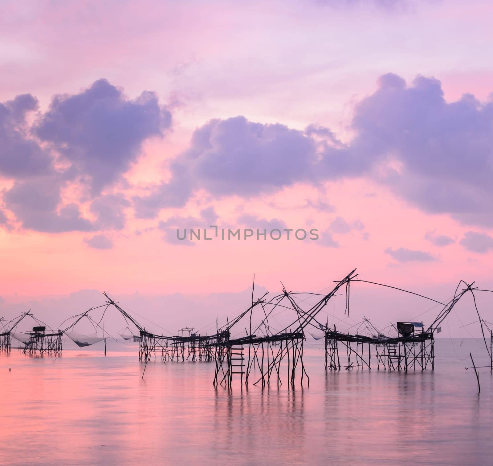 Beautiful sunrise seascape with Chinese fishing nets or shore operated lift nets in Phatthalung, Thailand