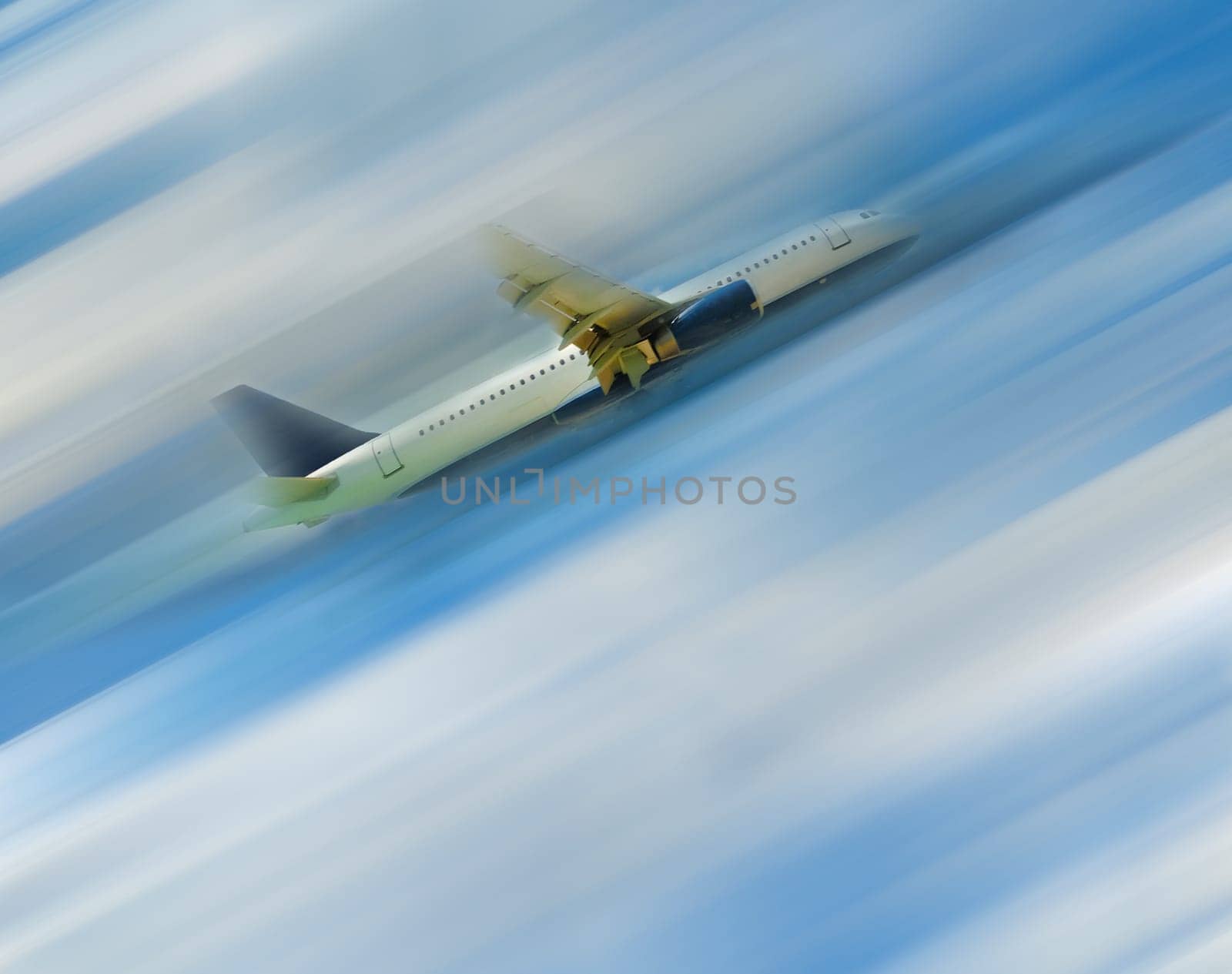 The airplane in the blue sky with clouds, blurred in postproduction
