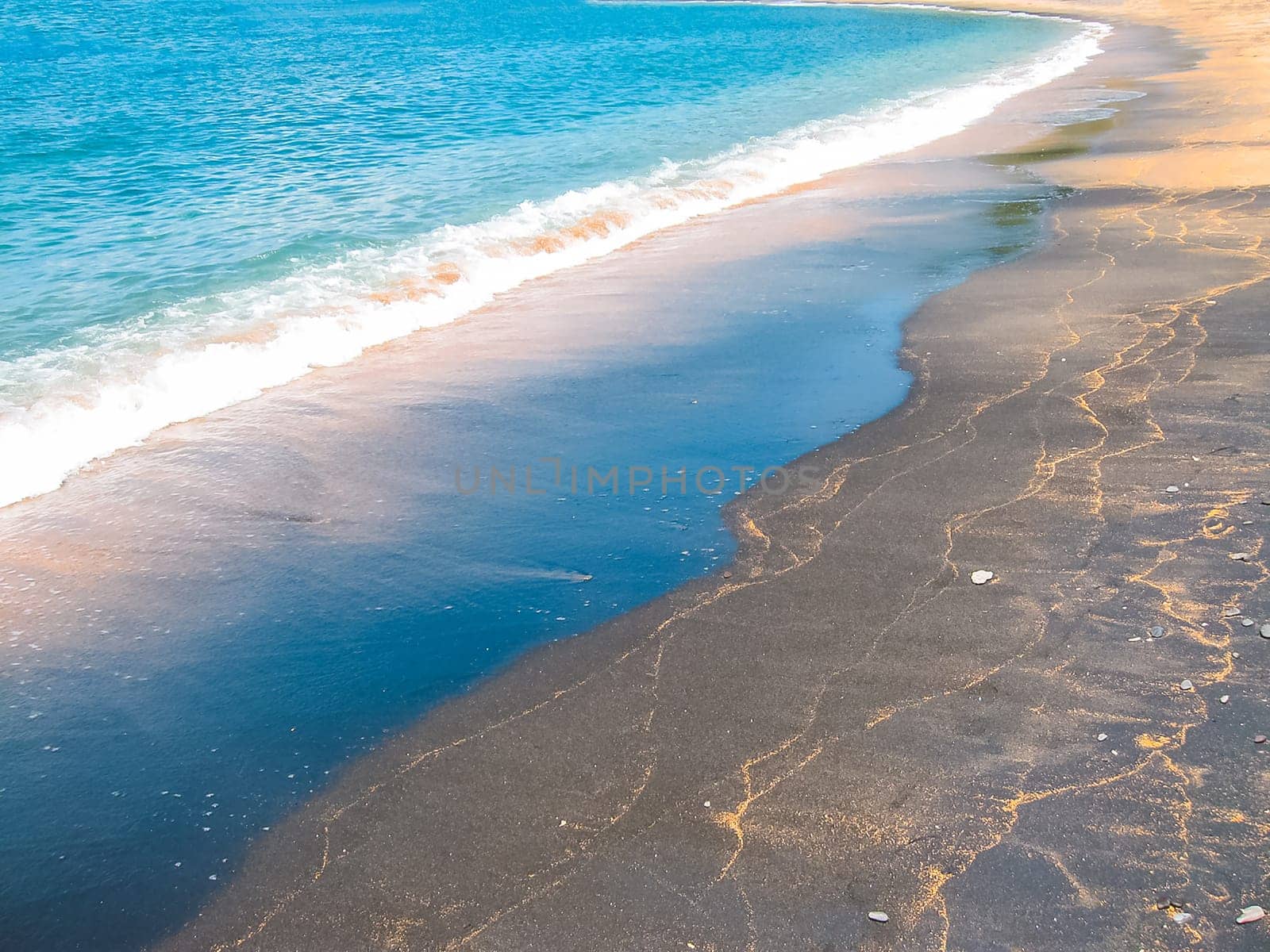 Black sand beach at Bali island at Indonesia