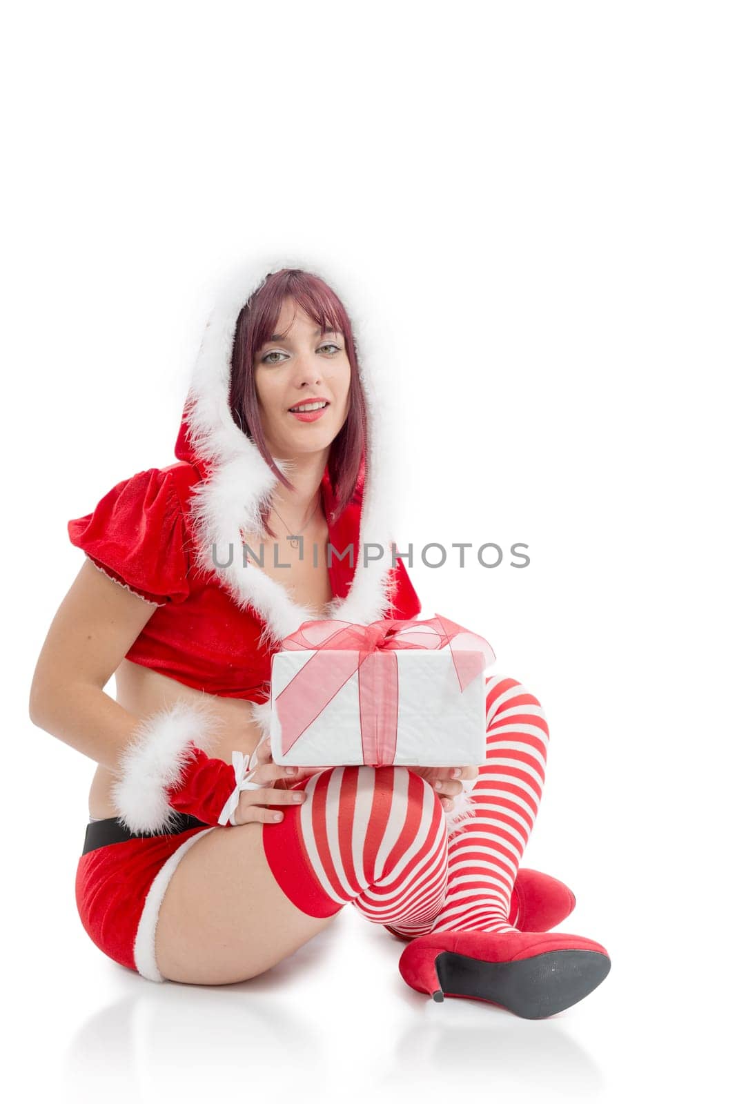 a portrait of beautiful  girl wearing santa claus clothes