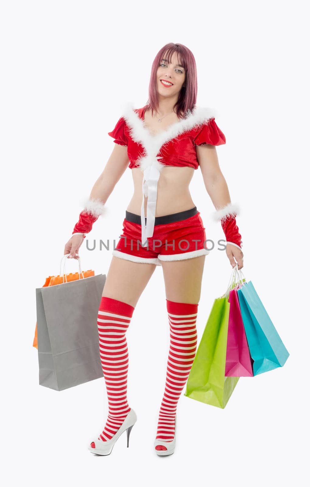 a beautiful Santa Claus woman holding shopping bags