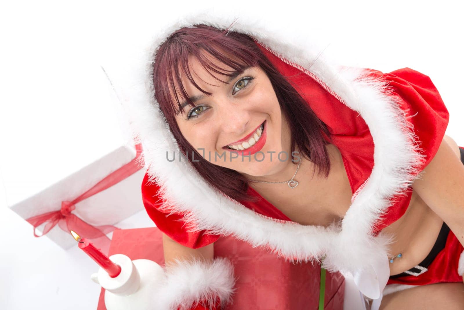 christmas. portrait of beautiful  girl wearing santa claus clothes