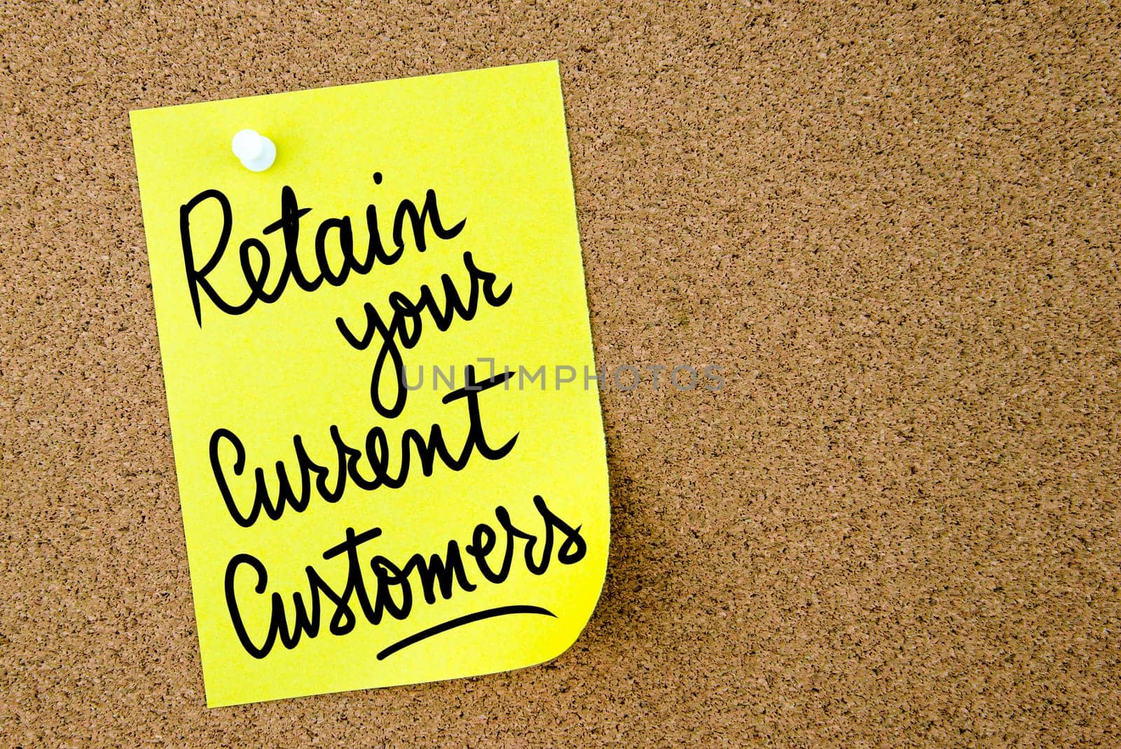 Retain Your Current Customers text written on yellow paper note pinned on cork board with white thumbtack. Business concept image with copy space available