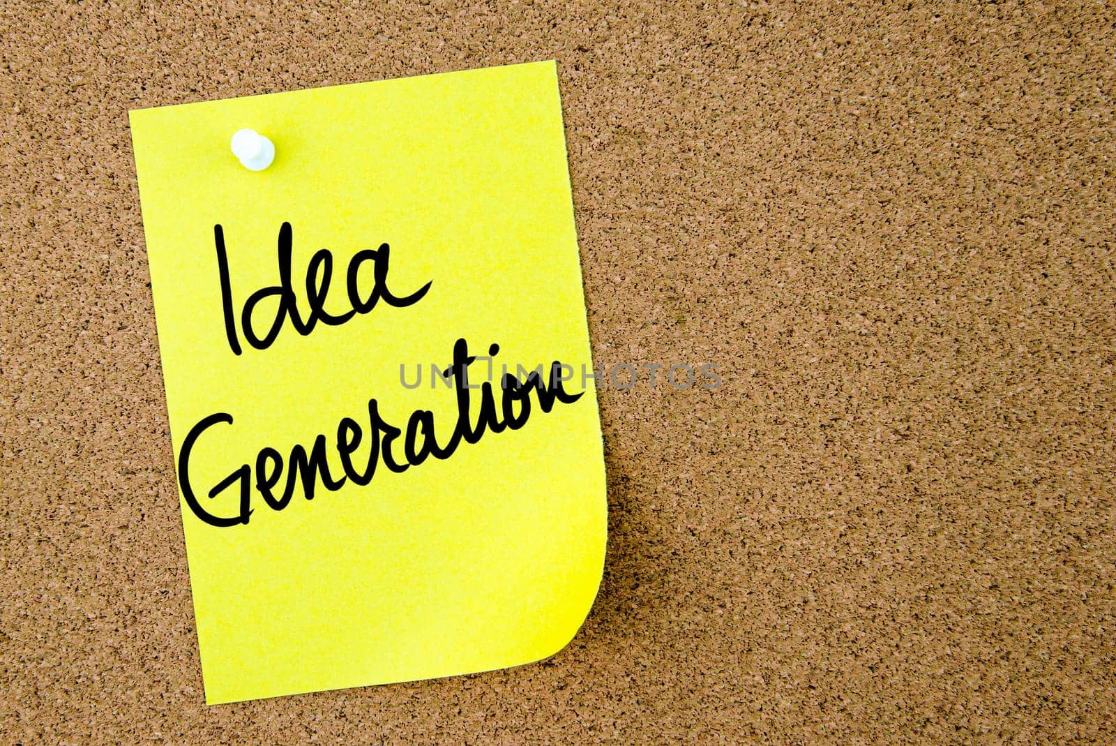 Idea Generation text written on yellow paper note pinned on cork board with white thumbtack. Business concept image with copy space available