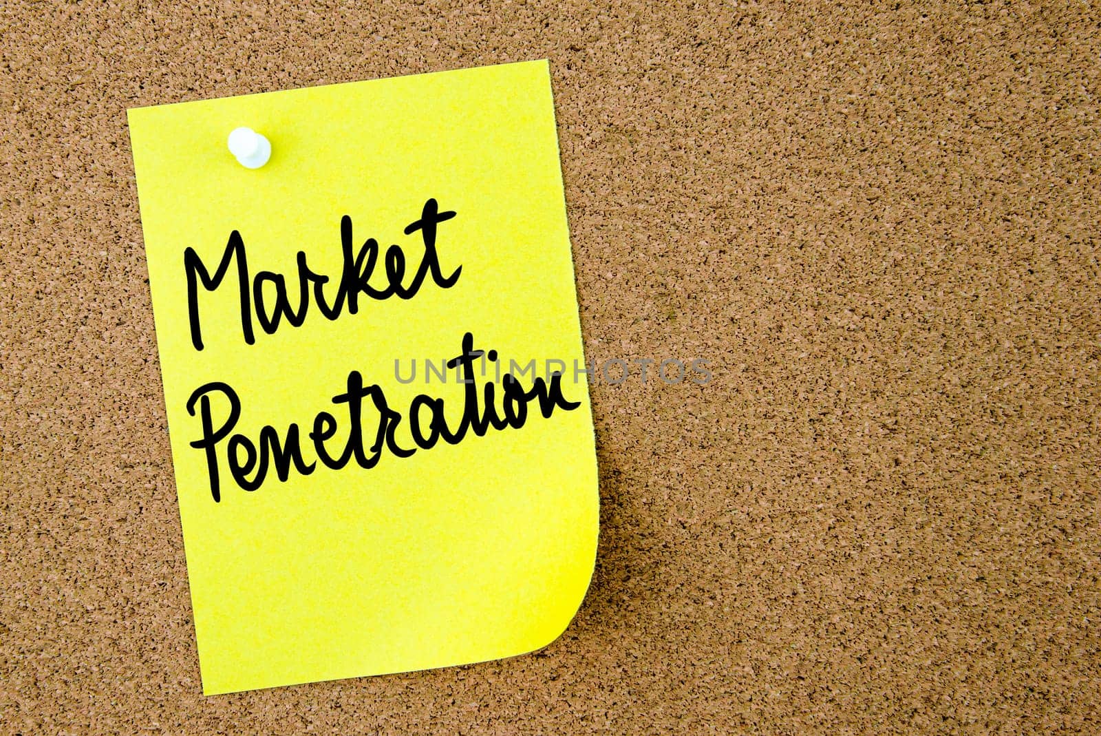 Market Penetration text written on yellow paper note pinned on cork board with white thumbtack. Business concept image with copy space available